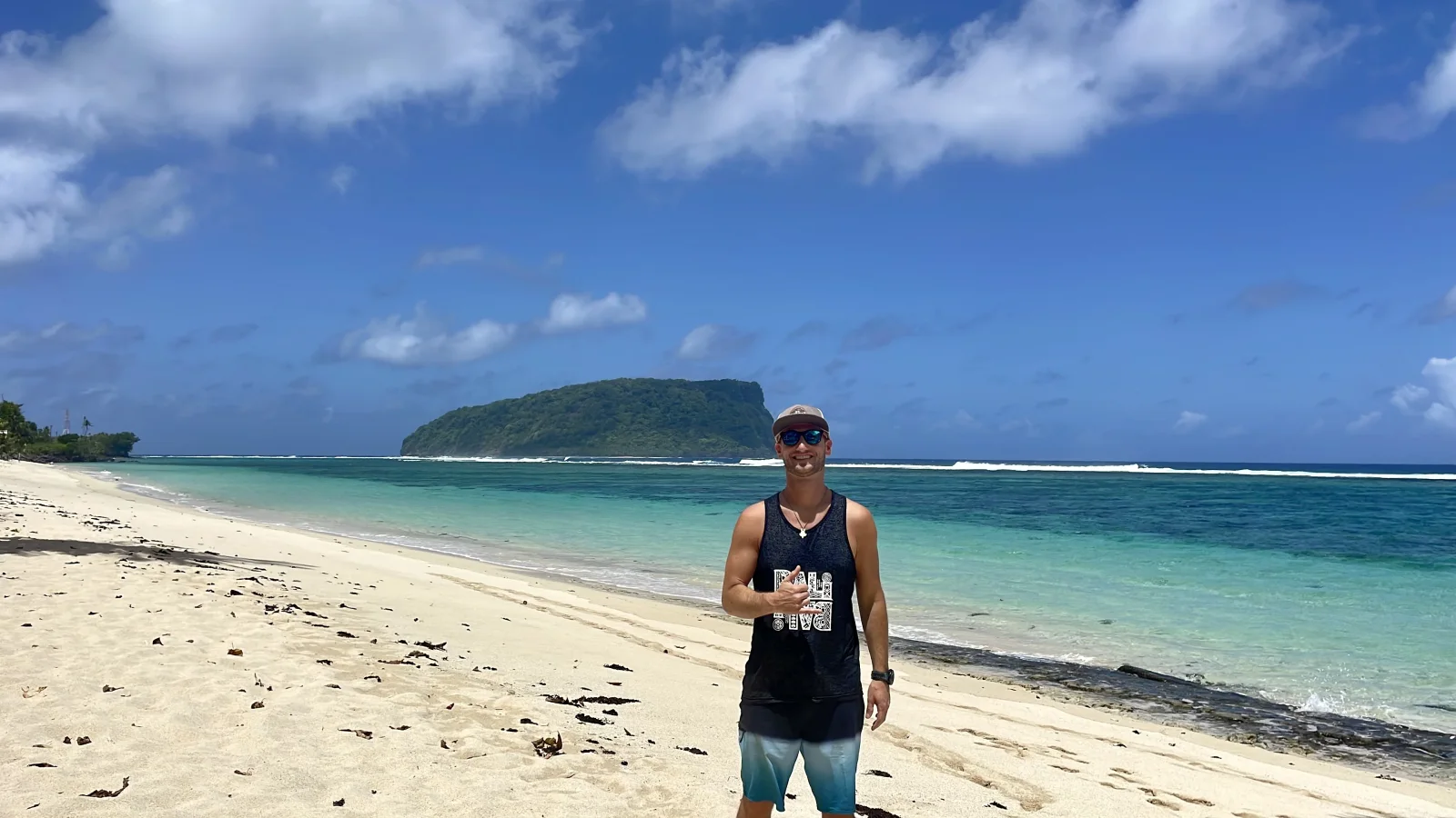 This is what not editing yourself looks like. | Me standing on an open beach in Samoa, turquoise water and an island behind, on being fully yourself in relationships, Love Unlocked. This is what not editing yourself looks like. | Me standing on an open beach in Samoa, turquoise water and an island behind, on being fully yourself in relationships, Love Unlocked.